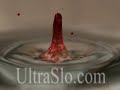 a beautiful red drop of water in slow motion