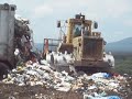 Caterpillar Trash Compactor Running Landfiil. Caterpillar Trash Compactor Running Landfiil.