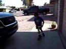 my Nephew on the scooter doing Tricks