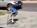 my Nephew on the scooter doing Tricks