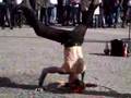 crazy street performer in amsterdam headstand fireball spit