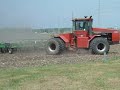 using a case ih 9180 and a 42' field cultivator to level a field for planting