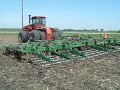 using a case ih 9180 and a 42' field cultivator to level a field for planting