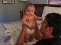 Reese stands with help, almost 3 mos.