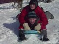 two people hit camera guy on sled