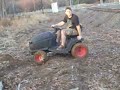 Riding lawn mower in the mud