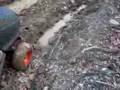 Riding lawn mower in the mud