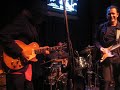 tommy calls artie chavez to play drums as he plays with school of blues musicians.  tommy and john garcia tear it up.
