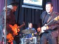 tommy calls artie chavez to play drums as he plays with school of blues musicians.  tommy and john garcia tear it up.