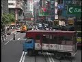 In 1997, just before the handover of Hong Kong to China, a complete tram ride across Hong Kong island from Western Market to Happy Valley was recorded. These are a few scenes from a continuous journey that captures every rattle and bounce of a creaky streetcar making its way across a dynamic city  in constant change.