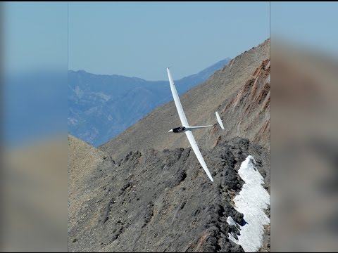 Glider Looping Near Mountain