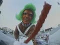 Wee man skating through the streets as an Oompa Loompa
