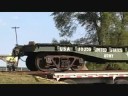 Former US Army Railroad Car is Unloaded From a Semi