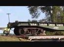Former US Army Railroad Car is Unloaded From a Semi