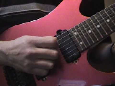 how to properly hold a guitar pick