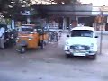 Tropical sunset behind urban scene in South India textile manufacturing city of Coimbatore while driving on the main 