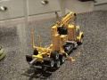 Custom toy logging trucks and log loaders