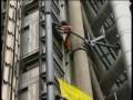 Alain Robert the french Spiderman climbs the Lloyds Building in London to highlight the 100 months global warming campaign.