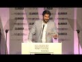 Facejacker's Kayvan Novak confuses Kelly Rowland as he presents her with a Glamour Award, putting on lots of different accents. Report by Sophie Foster. Like us on Facebook at www.facebook.com and follow us on Twitter at twitter.com