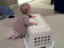 Addison walking with the laundry hamper