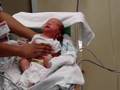 Newborn in neonatal intensive care unit