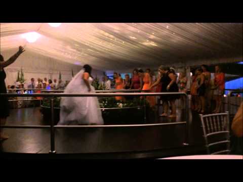 A wedding guest falls head-over-heels in love for the bride's bouquet in this great wedding fail...LITERALLY!