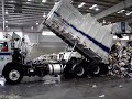 Heil garbage truck unloading at transfer station