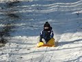 Samuel sledding at the Land 2