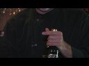 When decanting a bottle of wine, the foil should be removed before lightly screwing the corkscrew down the middle of the cork for removal. Learn about decanting red wine, including checking the cork for moistness, from a wine connoisseur in this free video on wine information.