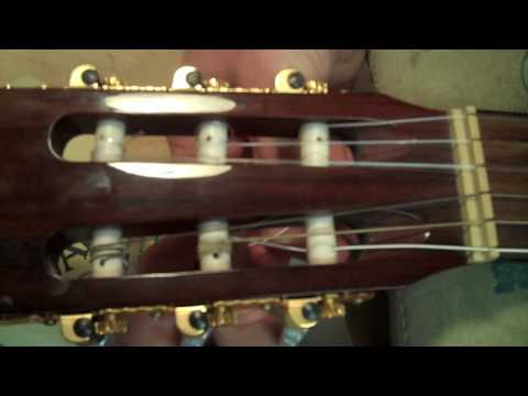 how to fasten classical guitar strings