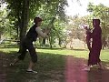me and a friend dressed in a pirate suit and grim reaper suit fighting with cruthches