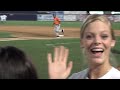 Caleb batting & Carly smiling & waving