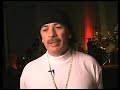 noel lee presenting santana with a monsterous award