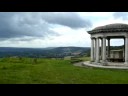 from colley hill, looking to the south-west.  

heavy storm clouds gather, but the storm, and most of the rain, swept away to the east.

the inscription on the folly reads:  
presented to the corporation of the borough of reigate for the benefit of the public by lieutenant-colonel robert william inglis in 1909.

see sepatare video for the mosaic under the roof.