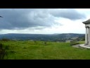 from colley hill, looking to the south-west.  

heavy storm clouds gather, but the storm, and most of the rain, swept away to the east.

the inscription on the folly reads:  
presented to the corporation of the borough of reigate for the benefit of the public by lieutenant-colonel robert william inglis in 1909.

see sepatare video for the mosaic under the roof.