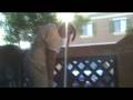 Kai shoving blocks through balcony