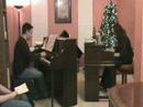 jonathan & jennifer mason perform variations on a theme by paganini by witold lutoslawski in a piano recital in their home on november 24, 2007