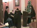 jonathan & jennifer mason perform variations on a theme by paganini by witold lutoslawski in a piano recital in their home on november 24, 2007