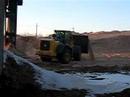 Deere 824J with large wood chip bucket