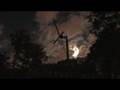 TIME LAPSE CLOUDS MOON RISING COLD FRONT WIND TURBINE TREES