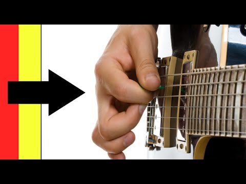 how to properly hold a guitar pick