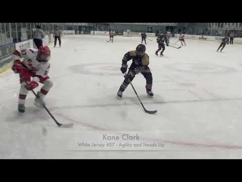 Kane Clark #57 White Jr. Canes Tier 1 AAA 2022. Zone entry, creates time and space and for pass to team mate.