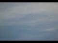 Three Black Orbs dancing and spinning around Each Other