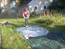 Abbe scootering down the slip and slide Abbe scootering down the slip and slide