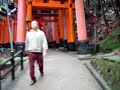 Walking through the 10,000 gates at Fushimi-Inari shrine in Kyoto, Japan.