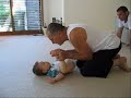at 14 and a half months max was unable to sit. his arms and legs were stiff and when held standing his knees turned inwards, his legs buckled and his feet distorted. he had a rounded back and moderate head control.

max is now 19 months and for the past 5 months nina and bert, max's parents, have been working with peter walker to help max become more flexible and to try to help him back into a more normal pattern of development.

max can now lay comfortably on his tummy, lifting his head with his arms begining to extend. he can sit independently in the first sitting position, and is learning to sit independently in the second. max has good head control and is now learning to stand upright in a normal fashion.