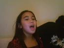 Abby singing \"all alone beneath the mistletoe\"