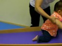 Baby Natalie climbing and sliding at Gymboree