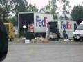 2007-12-21 | Fed-Ex ~> truck. I'm glad none of these packages are mine......fedex federal express packages dropping throwing tossing kicking delivery boxes bad business  (01:09)