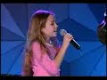 billy ray cyrus with a cute, young version of our now well-known popstar...miley cyrus (aka hannah montana) are singing a beautiful song...holding on to a dream.